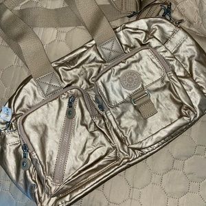 Kipling Defea with detachable, adjustable, swivel crossbody strap.